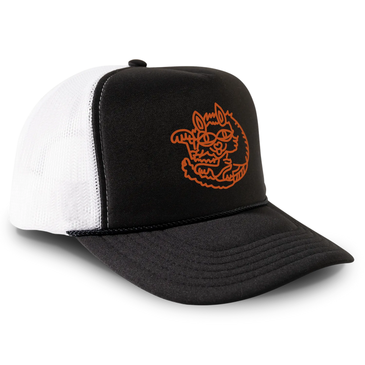 Black and white trucker hat with orange cartoon.