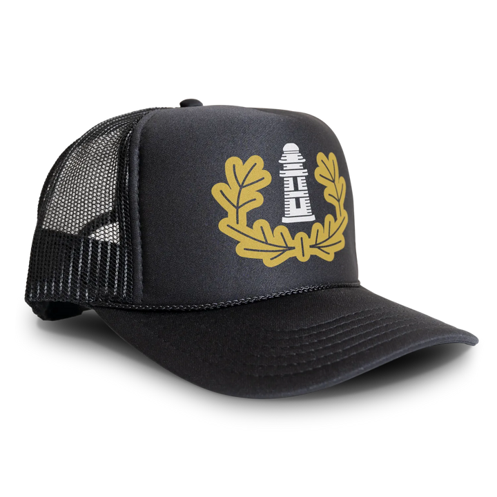 Black trucker hat with lighthouse emblem.