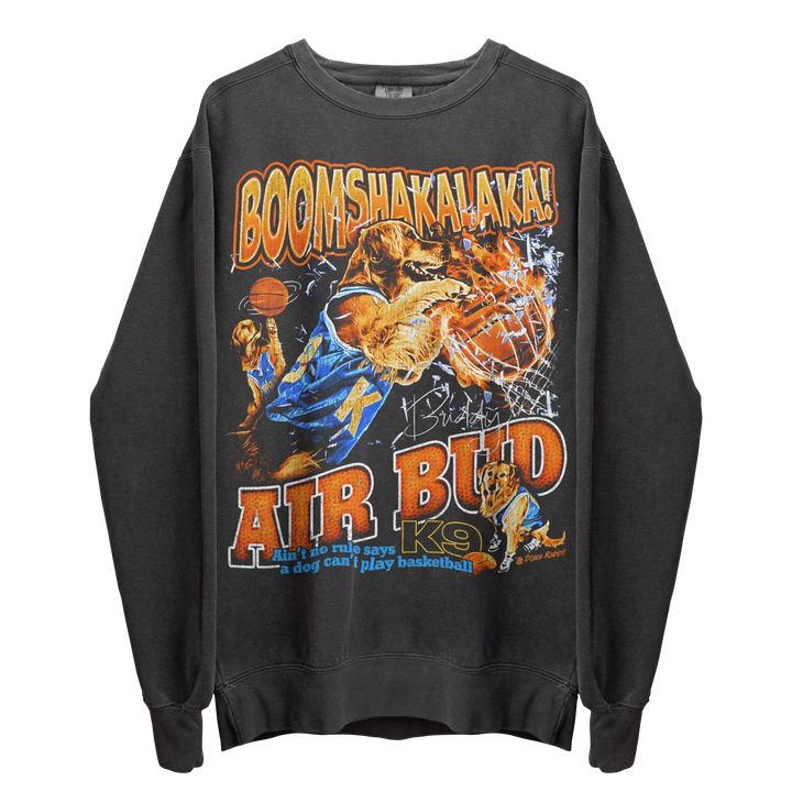A dark gray long-sleeved crewneck sweatshirt with a graphic print of a golden retriever playing basketball.