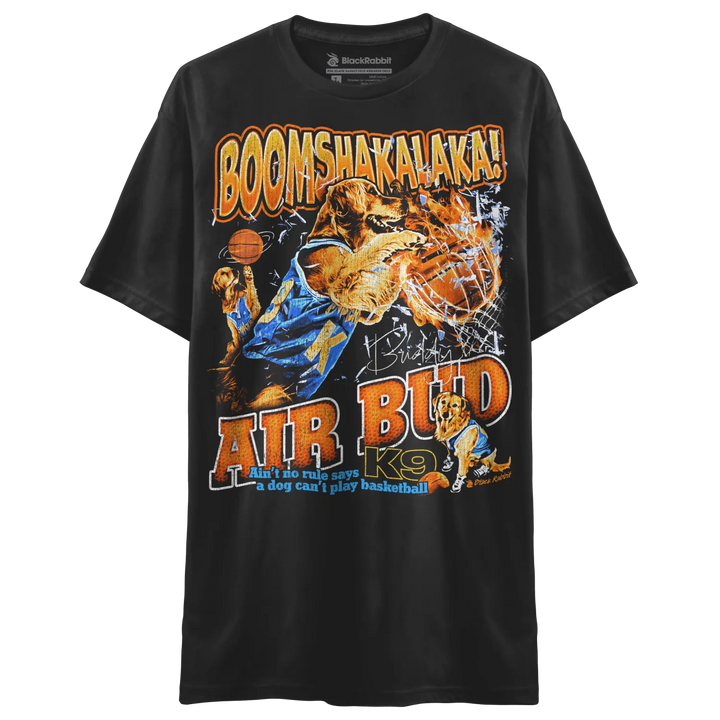 A black t-shirt featuring a graphic of a golden retriever playing basketball with the text ’BOOMSHAKALAKA!’ and ’AIR BUD K9’’.