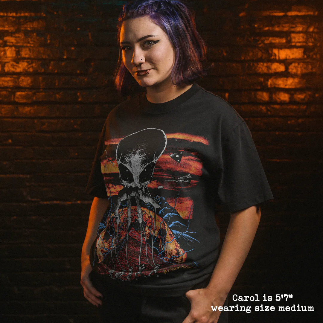 Model wearing heavy tee with Alien Overlord graphic 