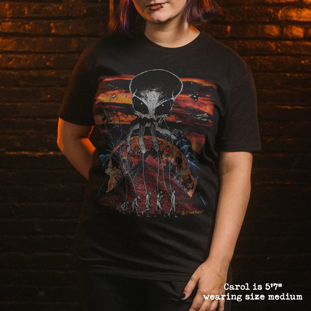 Model wearing black premium tee with alien overlord graphic 