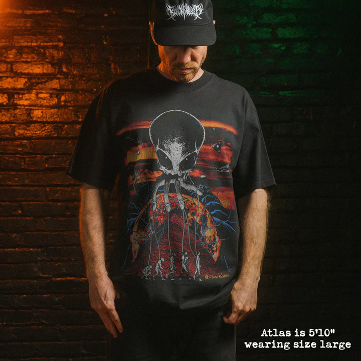 Model wearing heavy tee with Alien Overlord graphic 