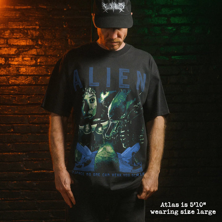 Model wearing heavy tee with Alien graphic 