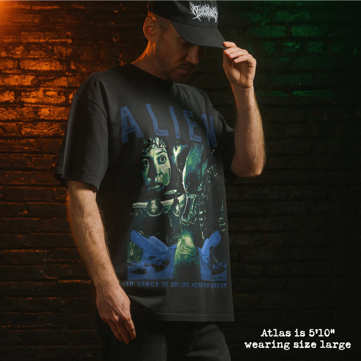 Model wearing heavy tee with alien graphic 
