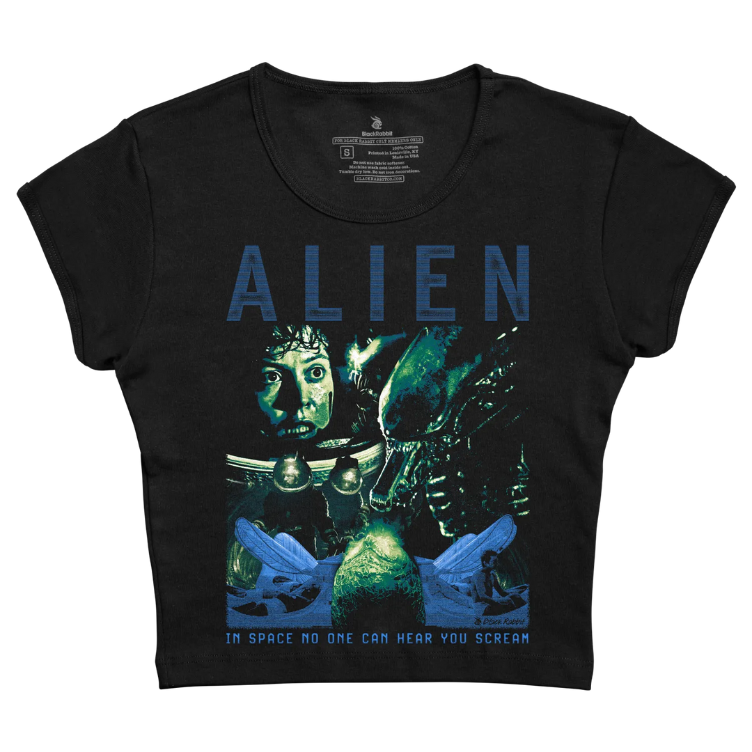 Black short-sleeved t-shirt featuring a graphic print of the movie ’alien’ with blue and green tones, depicting characters from the film.