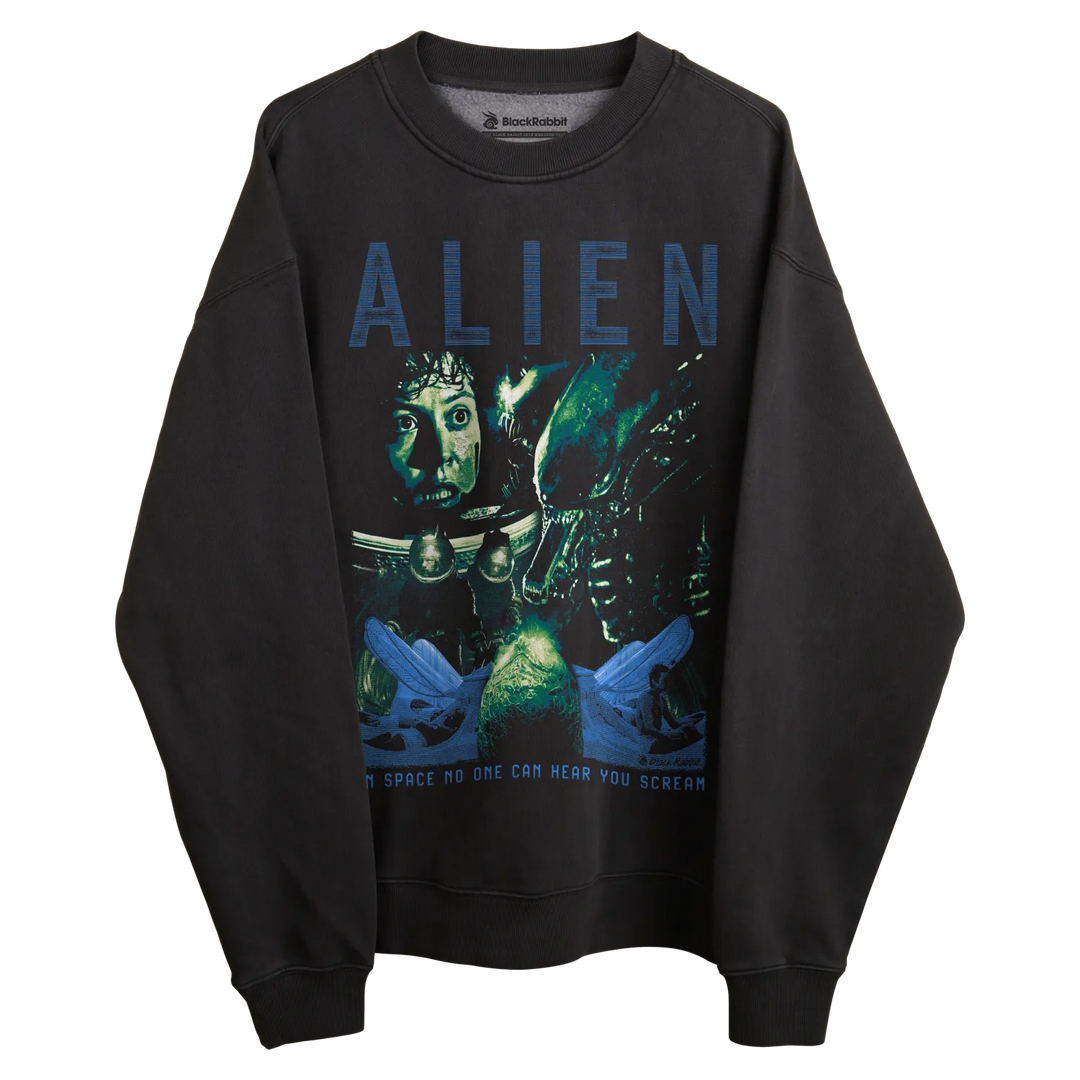 Black alien sweatshirt with blue text and graphic design featuring a space scene.