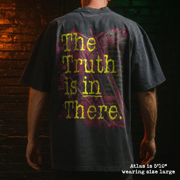 Male model wearing stone washed heavy tee with area 51 graphic 