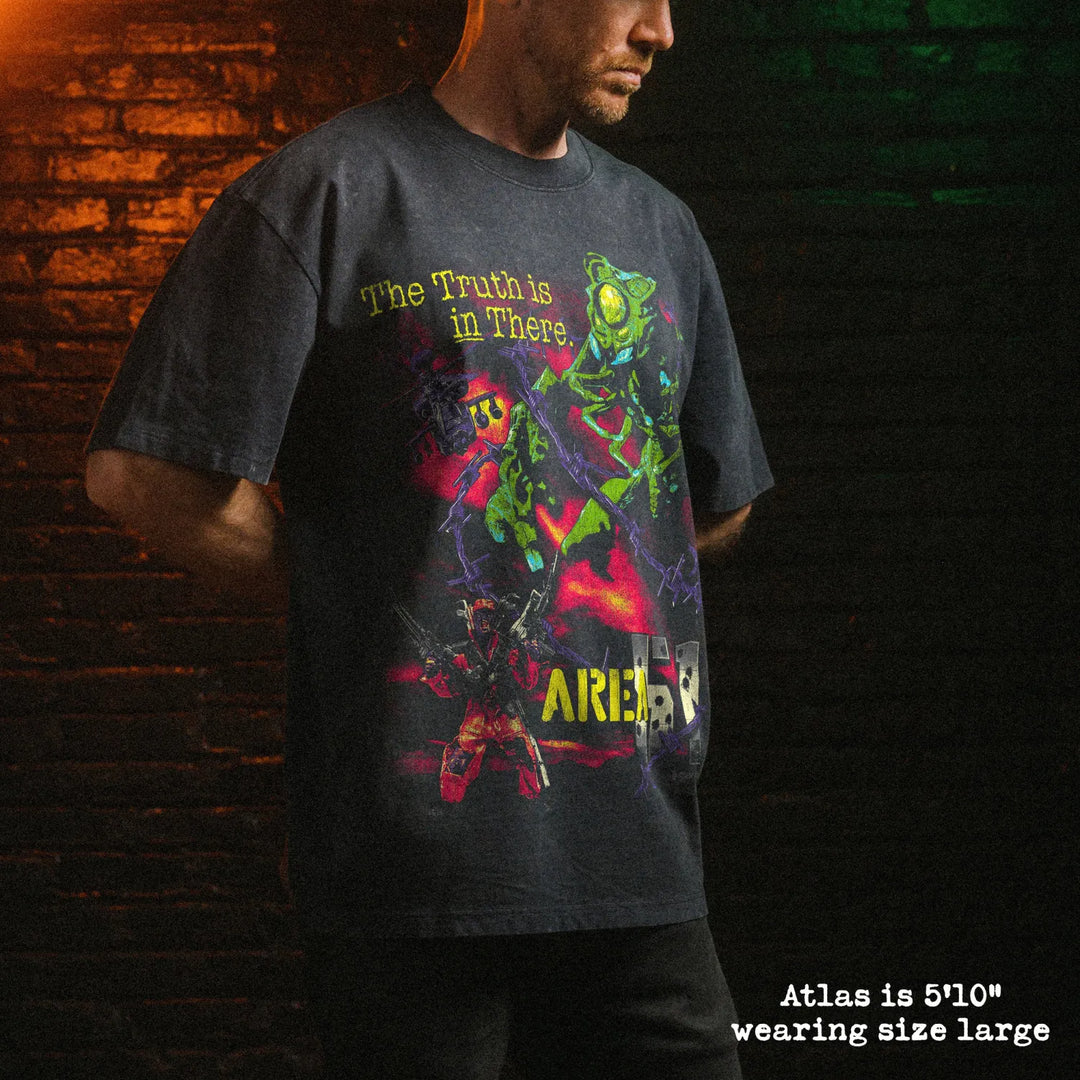Male model wearing stone washed heavy tee with area 51 graphic 