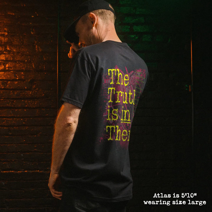 Male model wearing black premium tee with area 51 graphic 