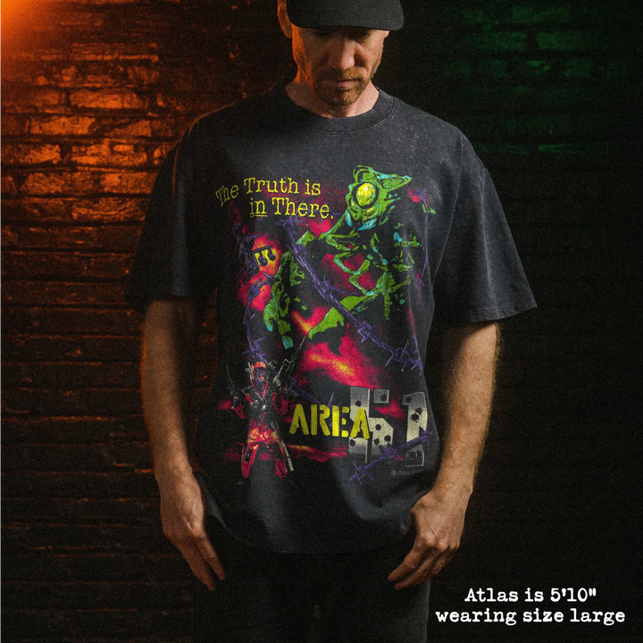 Male model wearing stone washed heavy tee with area 51 graphic 