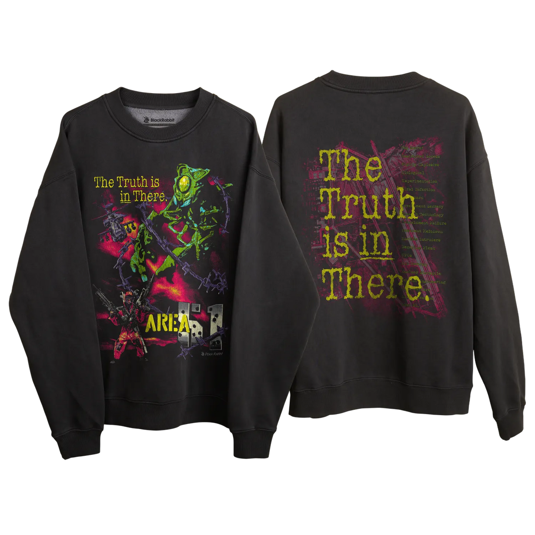’the truth is in there’ graphic sweatshirt with vibrant alien and spaceship design, black background.