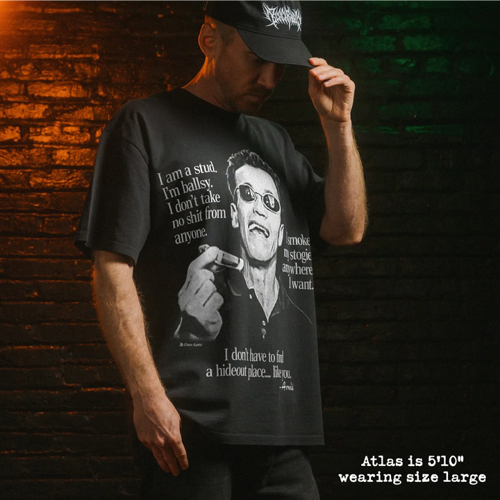 Model wearing heavy tee with arnold stogie graphic 