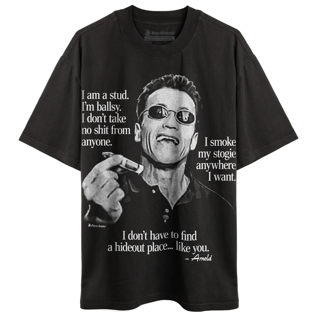 Black t-shirt with a monochrome graphic print of Arnold Schwarzenegger wearing sunglasses, holding a cigar, and with text quotes.
