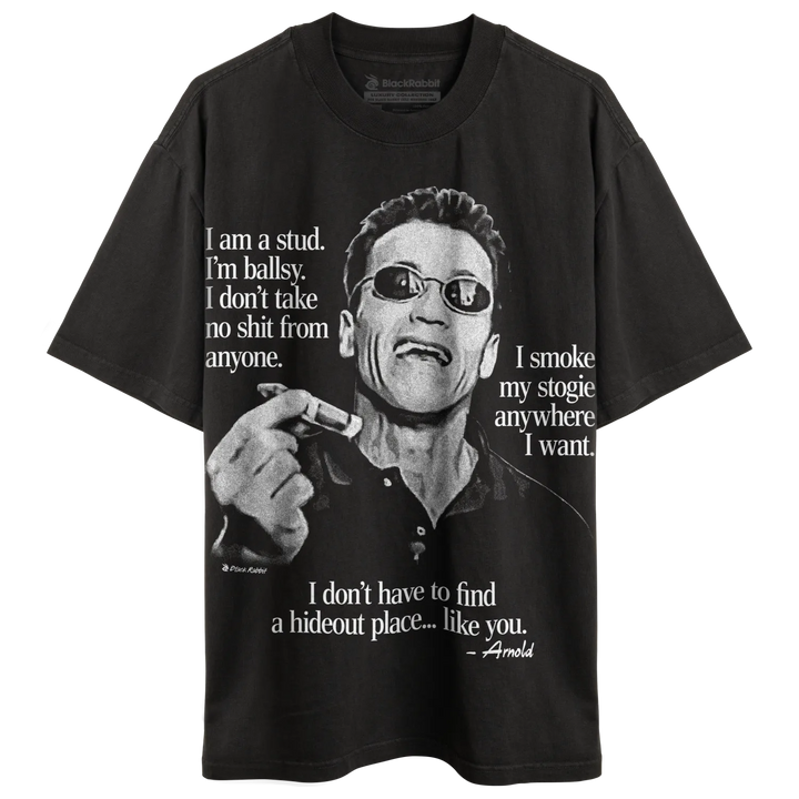 Black t-shirt with a monochrome graphic print of Arnold Schwarzenegger wearing sunglasses, holding a cigar, and with text quotes.