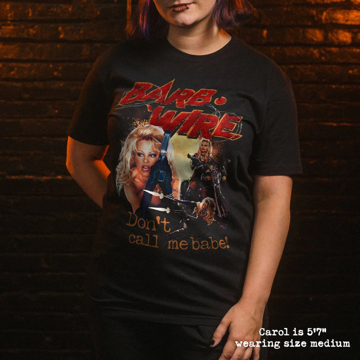 Model wearing black t shirt with Barb Wire graphic
