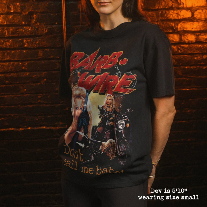 Model wearing heavy tee with barb wire graphic 
