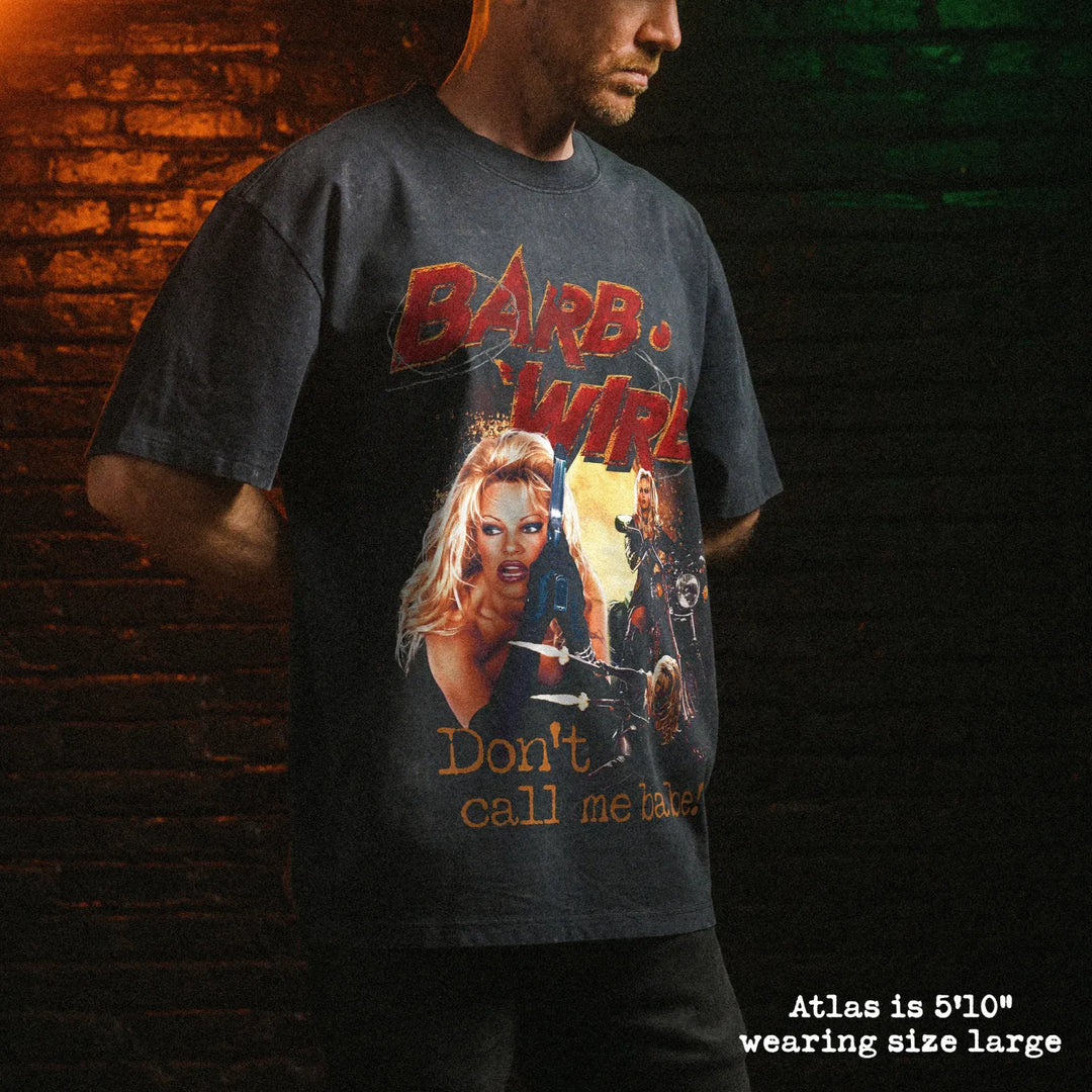 Male model wearing stone washed heavy tee with barb wire graphic 