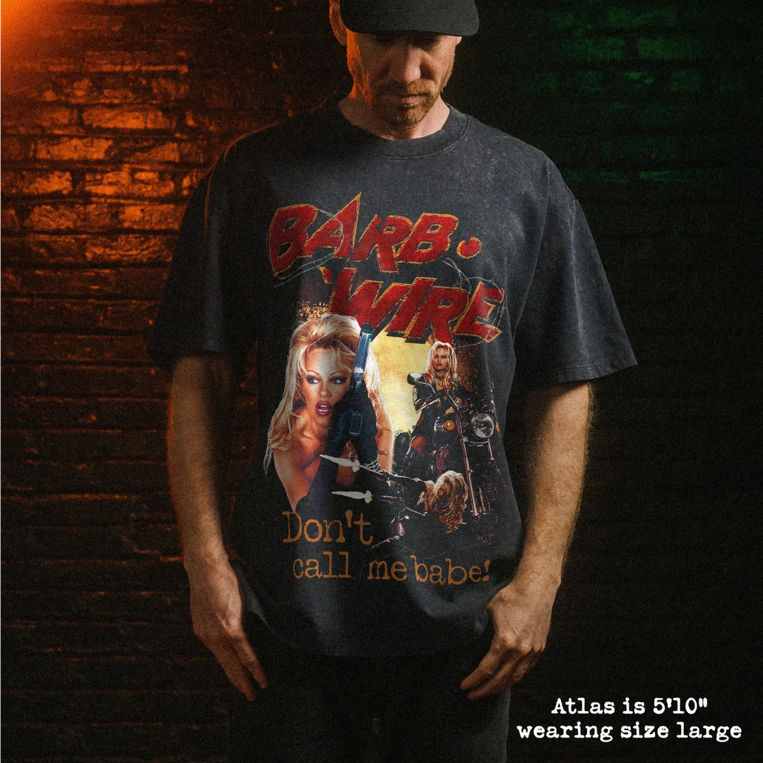 Male model wearing stone washed heavy tee with barb wire graphic 