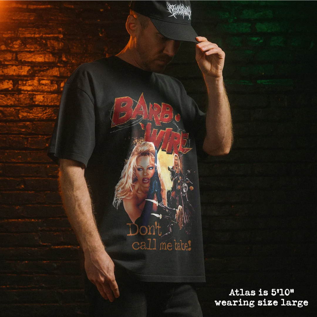 Model wearing heavy tee with barb wire graphic 