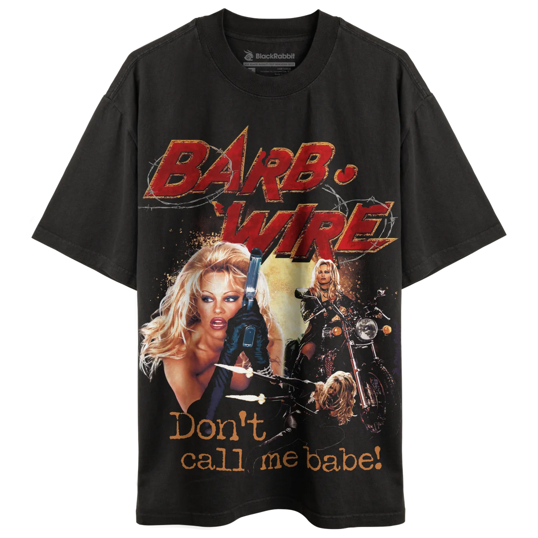 Black t-shirt with graphic design of ’barb wire’ and slogan ’don’t call me babe!’ featuring a woman holding guns.