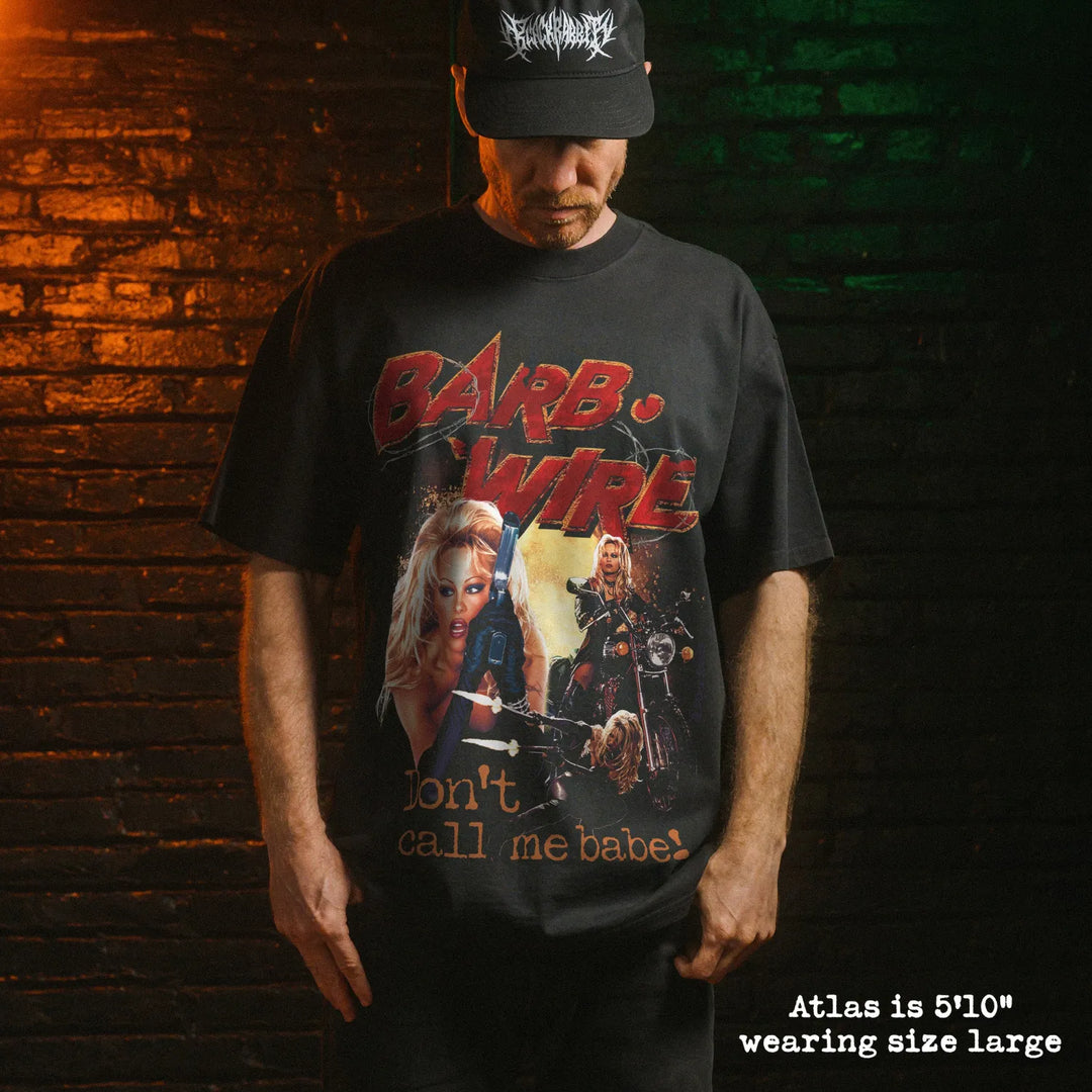 Model wearing heavy tee with barb wire graphic 
