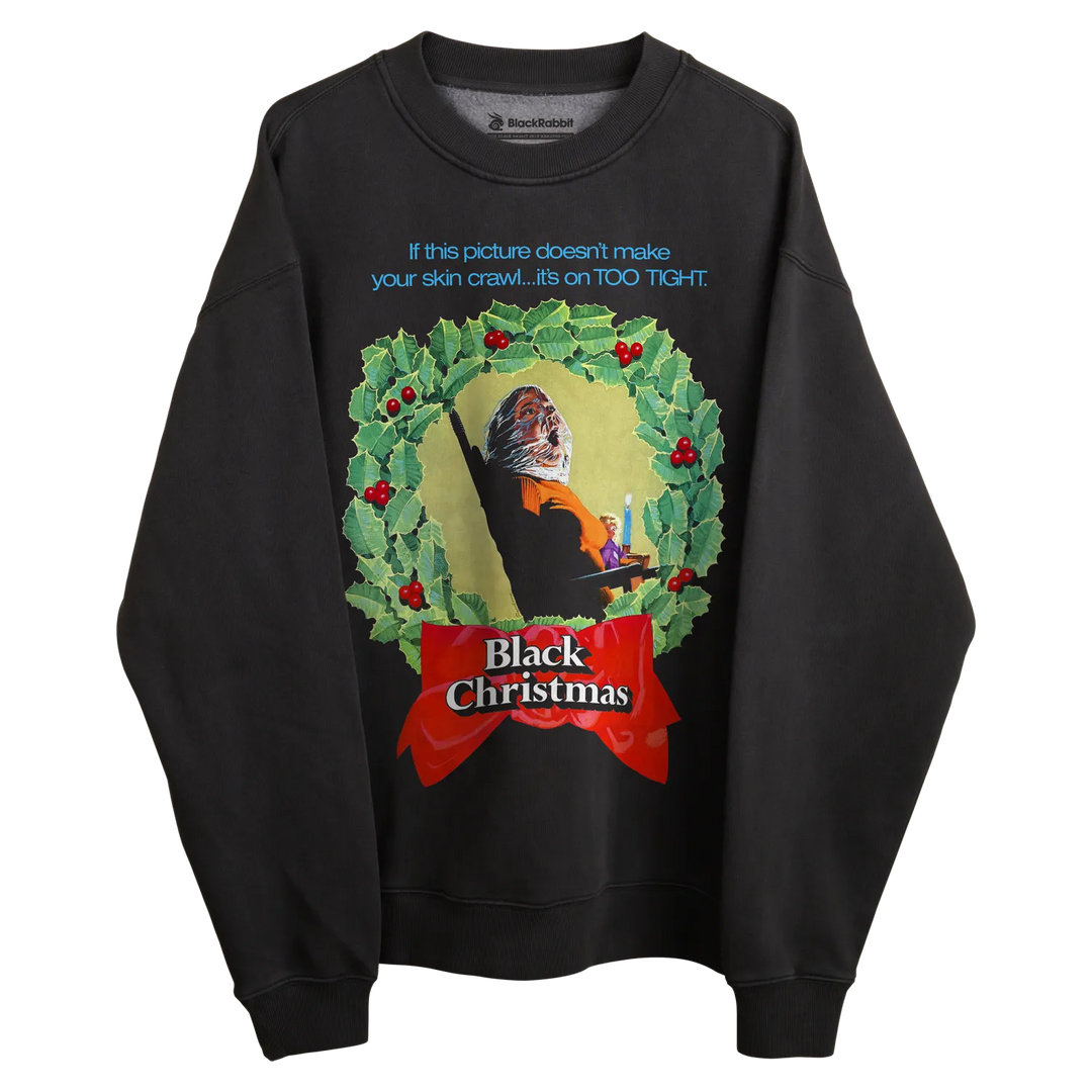 Black sweatshirt with ’black christmas’ design featuring a holly wreath and text.
