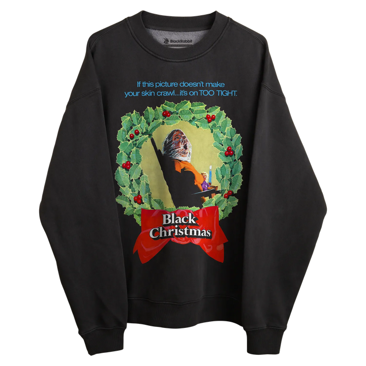 Black sweatshirt with ’black christmas’ design featuring a holly wreath and text.