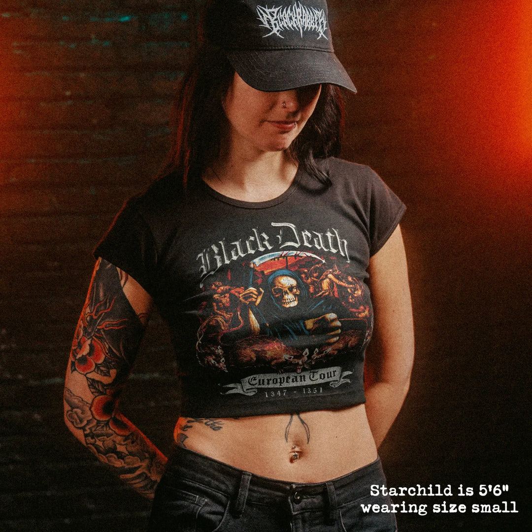 Female model wearing cropped baby tee with black death graphic
