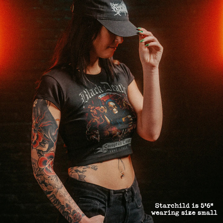 Female model wearing cropped baby tee with black death graphic
