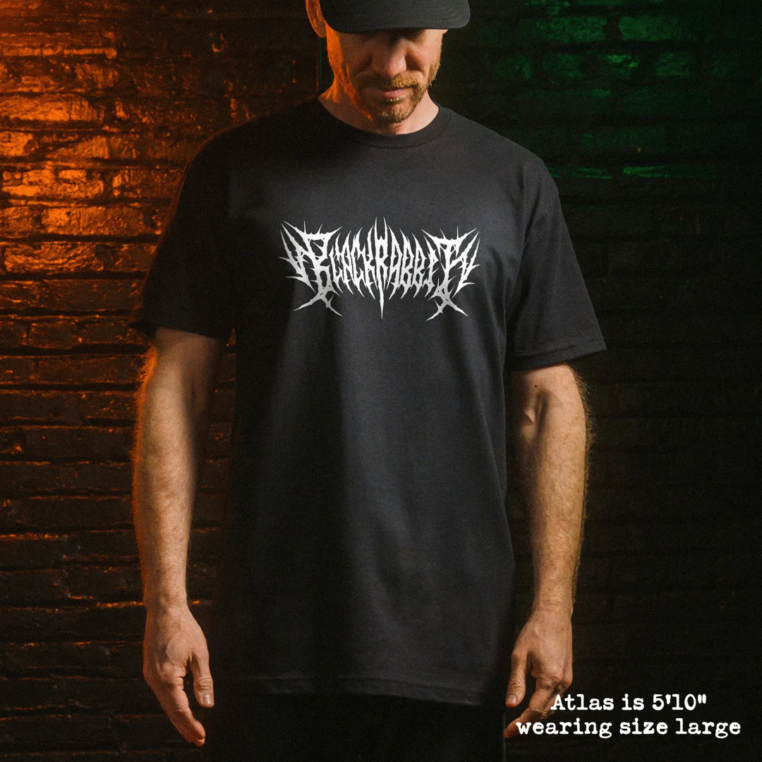 Male model wearing black premium tee with black rabbit death metal graphic 
