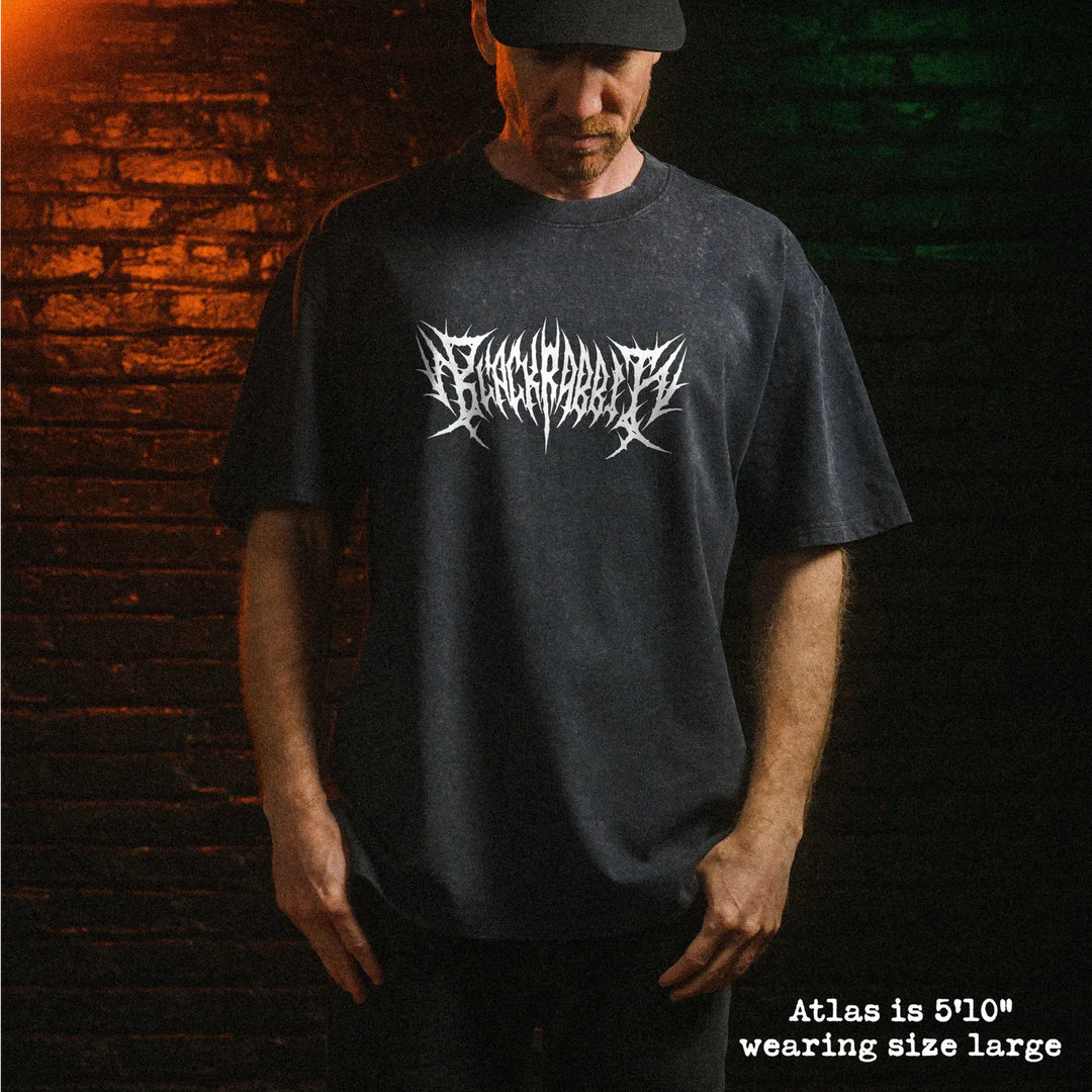 Male model wearing stone wash heavy tee with black rabbit death metal graphic 