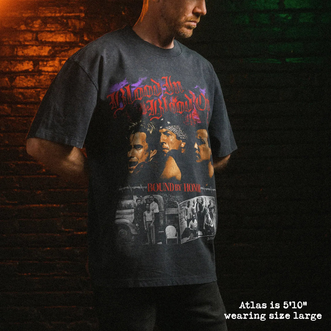 Male model wearing stone washed heavy tee with blood in blood out graphic 