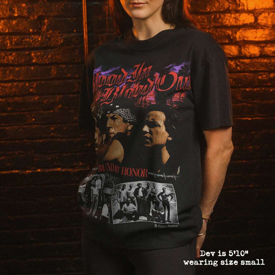 Model wearing heavy tee with blood in blood out graphic 