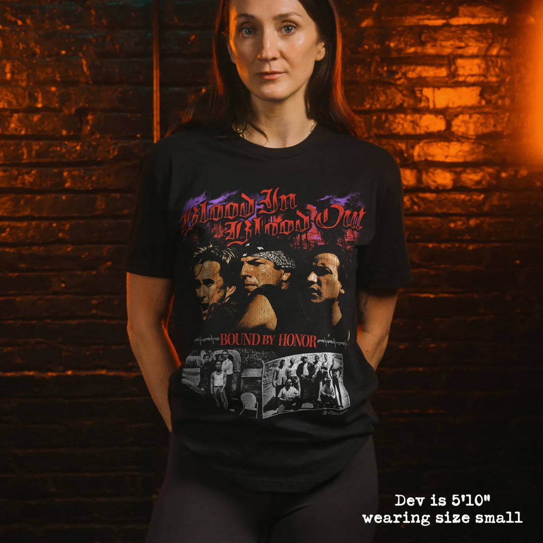 Model wearing black premium tee with blood in blood out graphic 