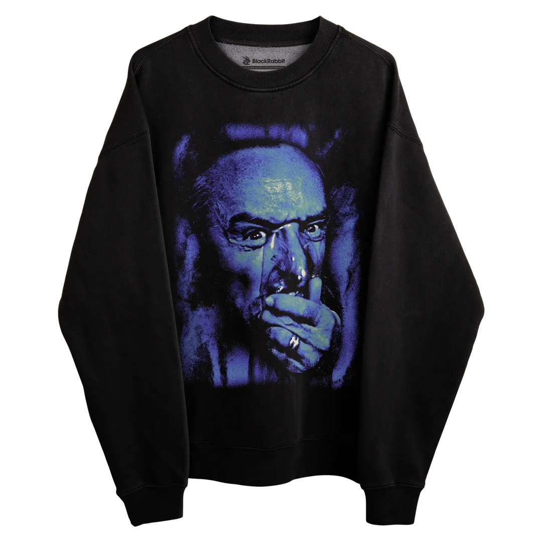 Black sweatshirt with graphic print of a man in purple and blue tones, featuring glasses.