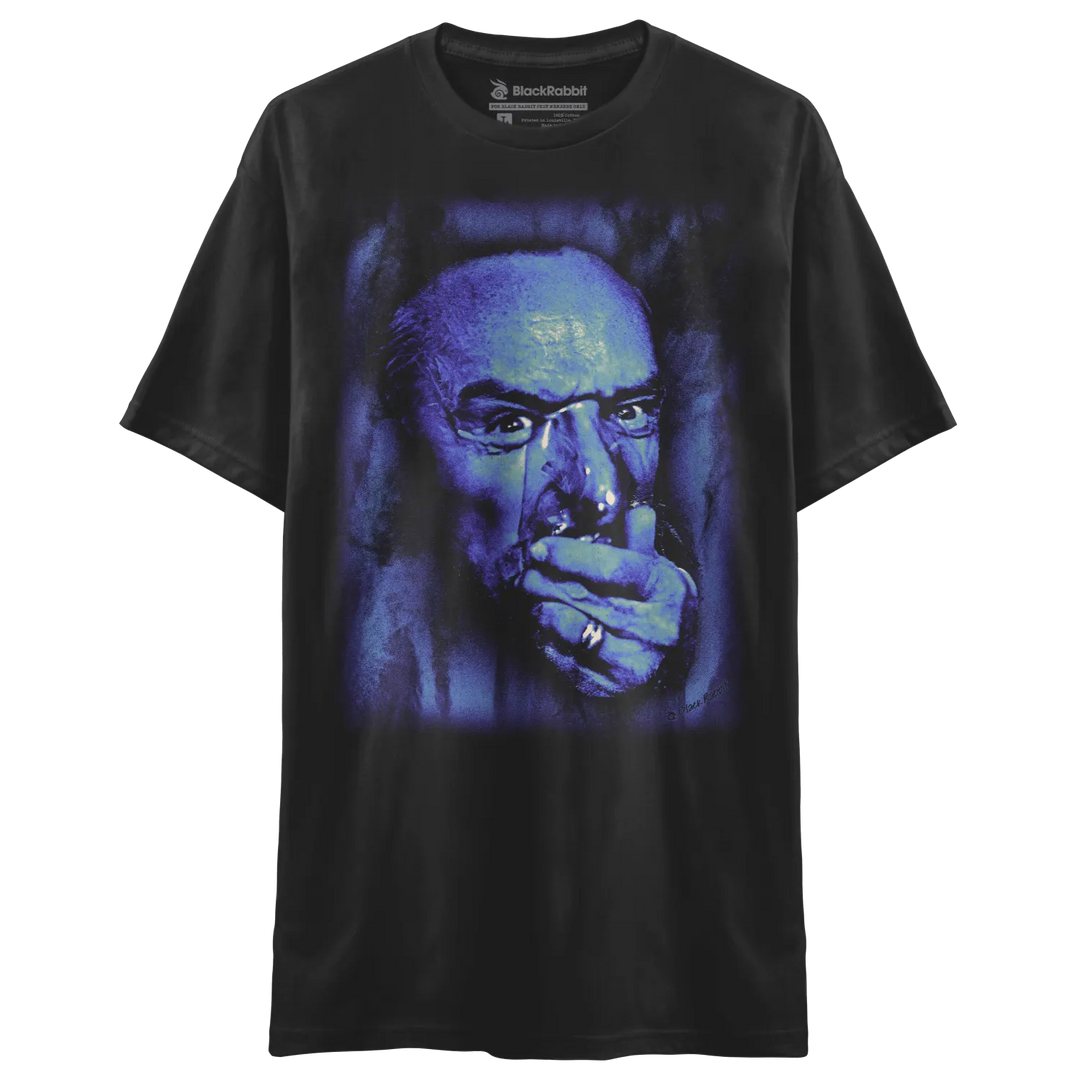 Black t-shirt with graphic print of a man smoking, dark blue and purple hues, rockland brand logo on left chest.
