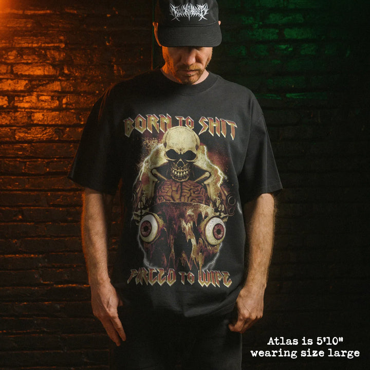Model wearing heavy tee with born to shit graphic 