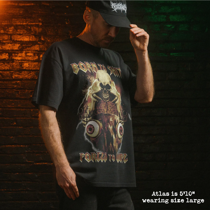 Model wearing heavy tee with born to shit graphic 