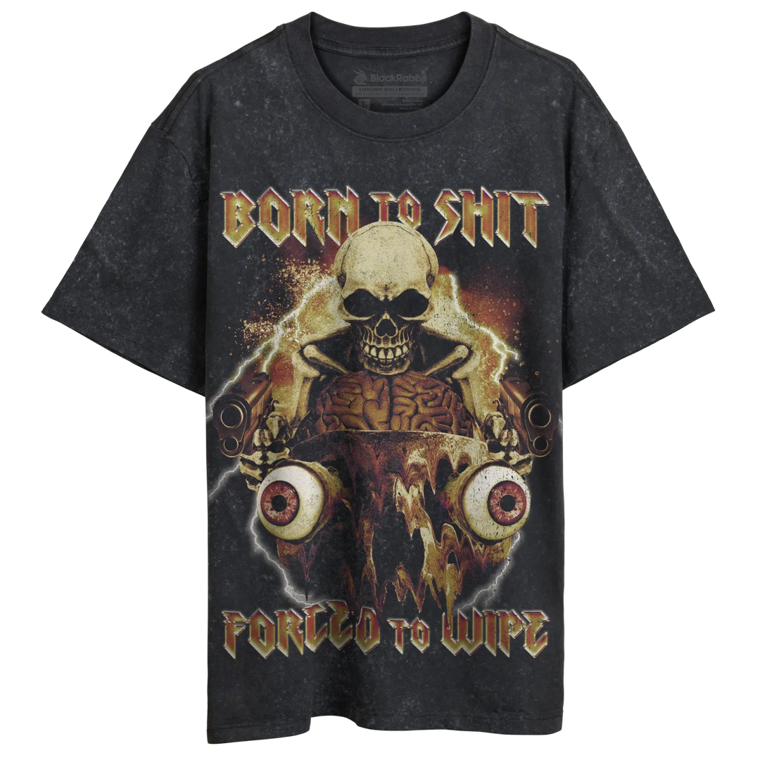 A black, short-sleeved t-shirt with a graphic print featuring a skull, exposed brains, and large eyeballs, surrounded by gold and orange accents, and the phrases ’BORN TO SHIT’ and ’FORCED TO WIPE’.