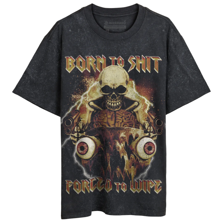 A black, short-sleeved t-shirt with a graphic print featuring a skull, exposed brains, and large eyeballs, surrounded by gold and orange accents, and the phrases ’BORN TO SHIT’ and ’FORCED TO WIPE’.