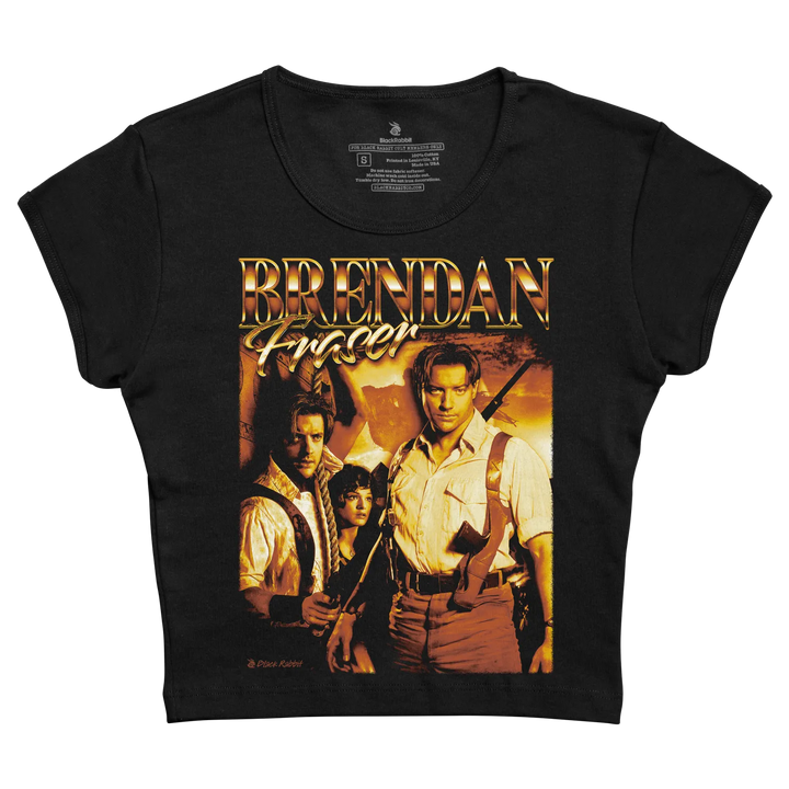 Black short-sleeved t-shirt featuring a golden ’brendan fraser’ graphic above an image of the actor with two other characters from his film, printed in vibrant warm tones.