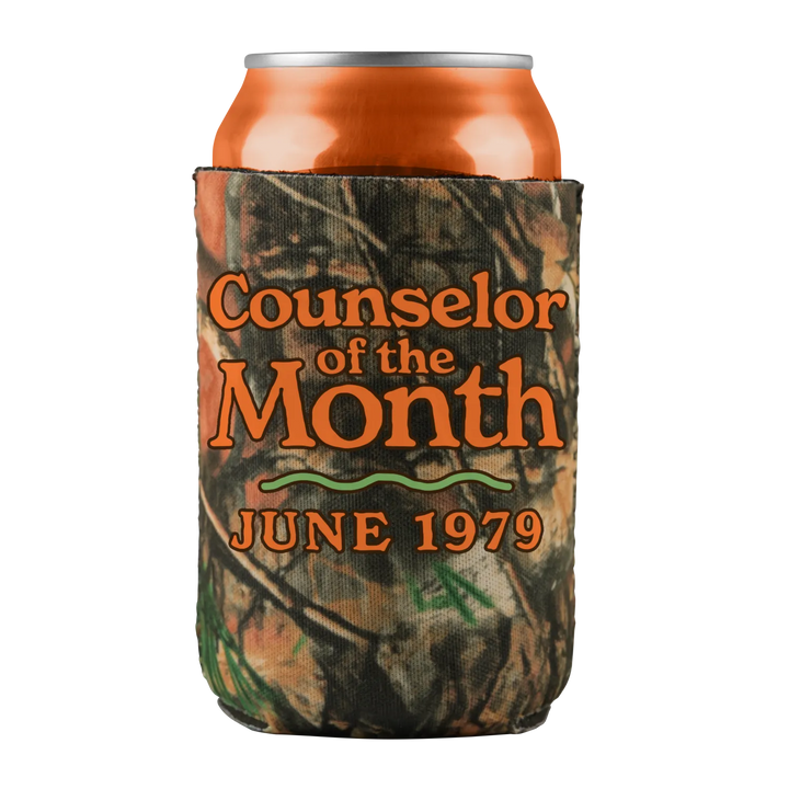 Camo-patterned beverage koozie with an orange soda can.