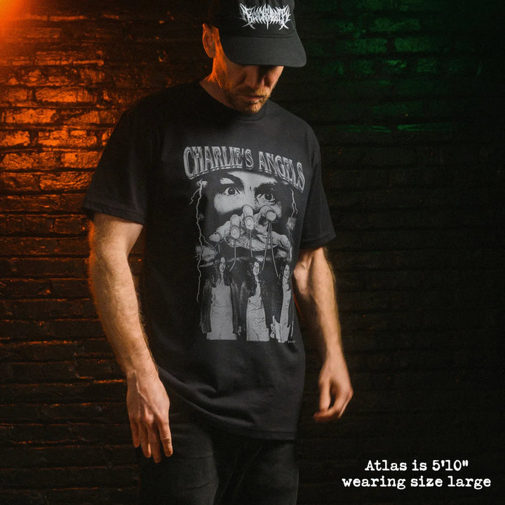 Male model wearing black premium tee with charlies angels graphic 