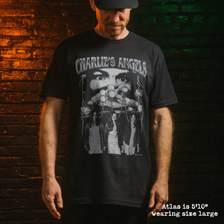 Male model wearing black premium tee with charlies angels graphic 