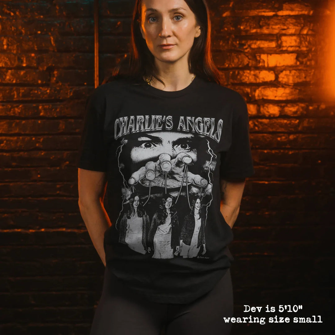 model wearing black premium tee with charlies angels graphic 