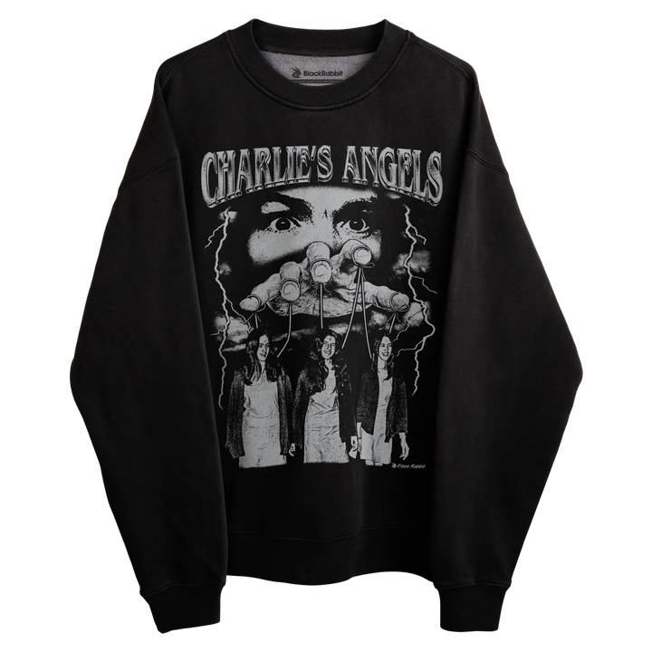 Black long-sleeved sweatshirt with ’charlie’s angels’ graphic design featuring three women and a man, likely made of cotton or polyester blend.