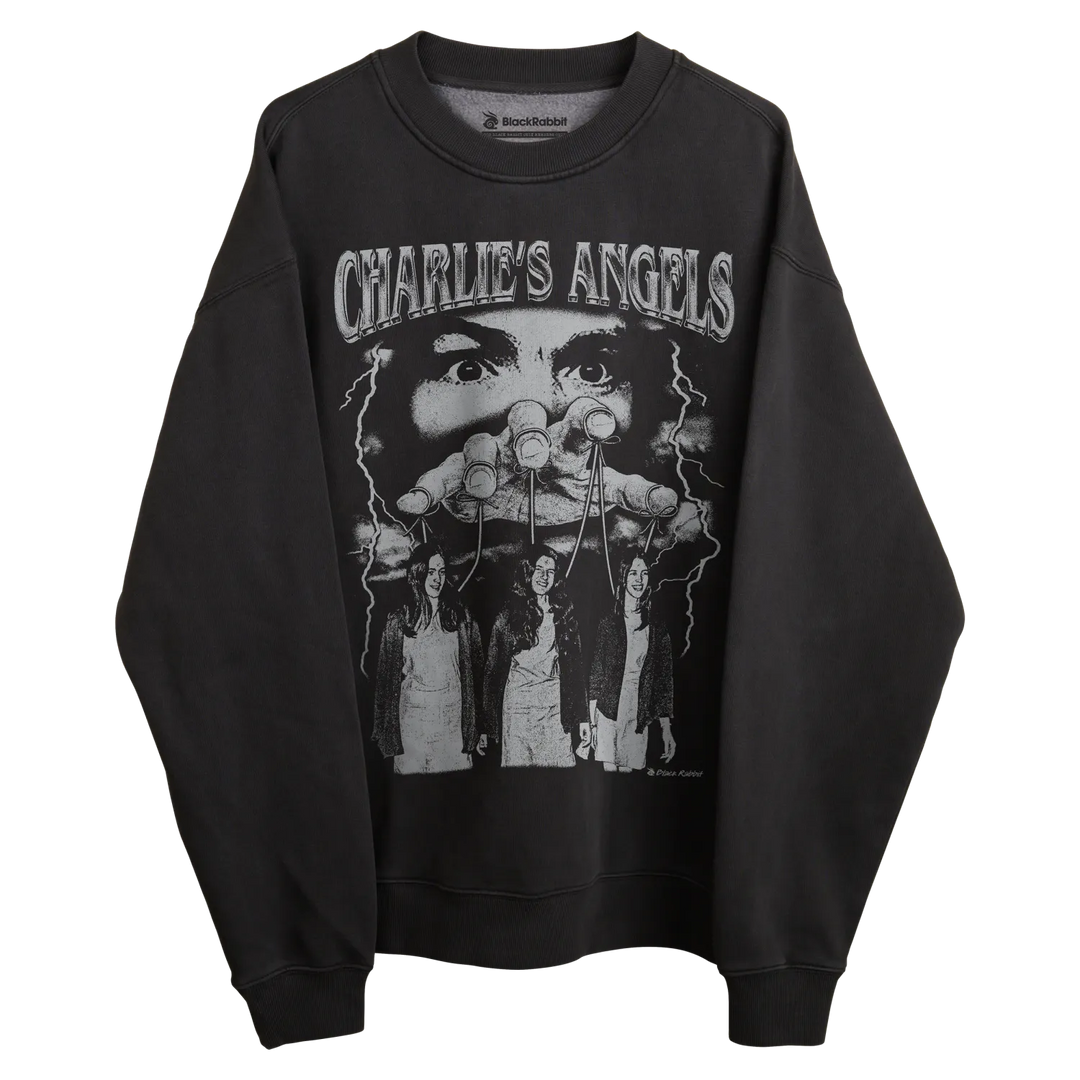 Black long-sleeved sweatshirt with ’charlie’s angels’ graphic design featuring three women in white outfits.