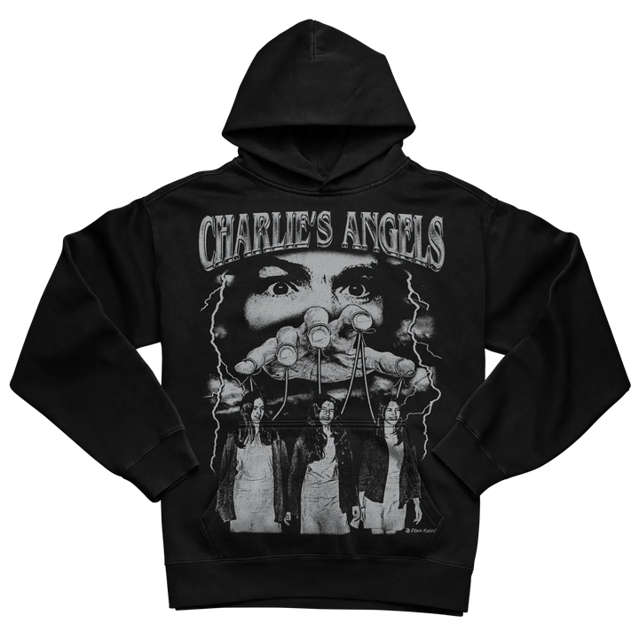 Black hoodie with ’charlie’s angels’ graphic and three female figures design, featuring a man’s face in the background.