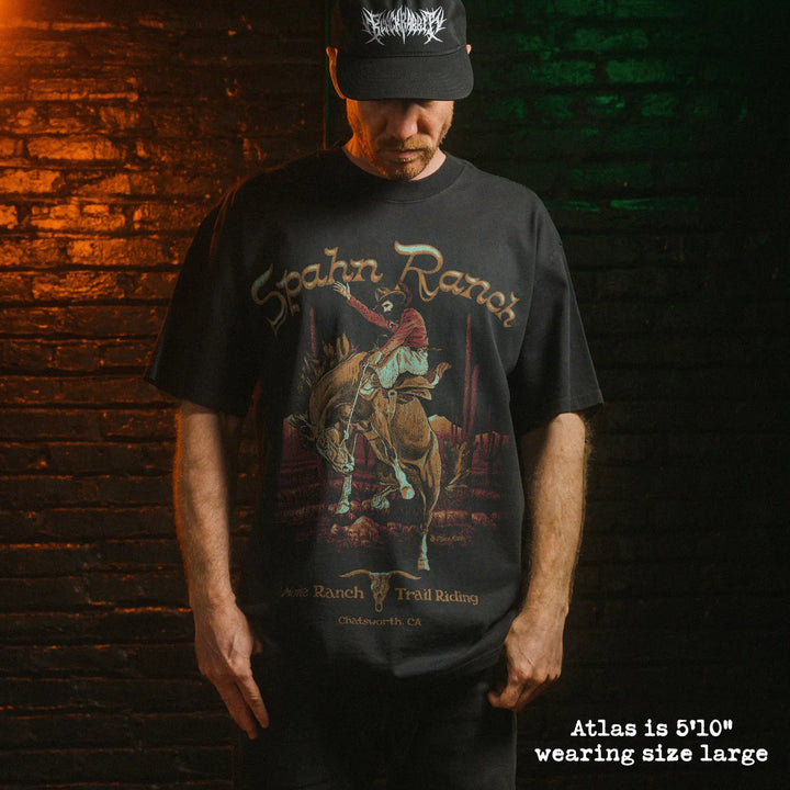 Model wearing heavy tee with spahn ranch graphic 